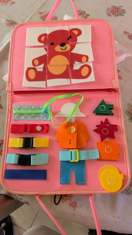 Libro rosa con puzle de osito y hebillas, foto de una compradora